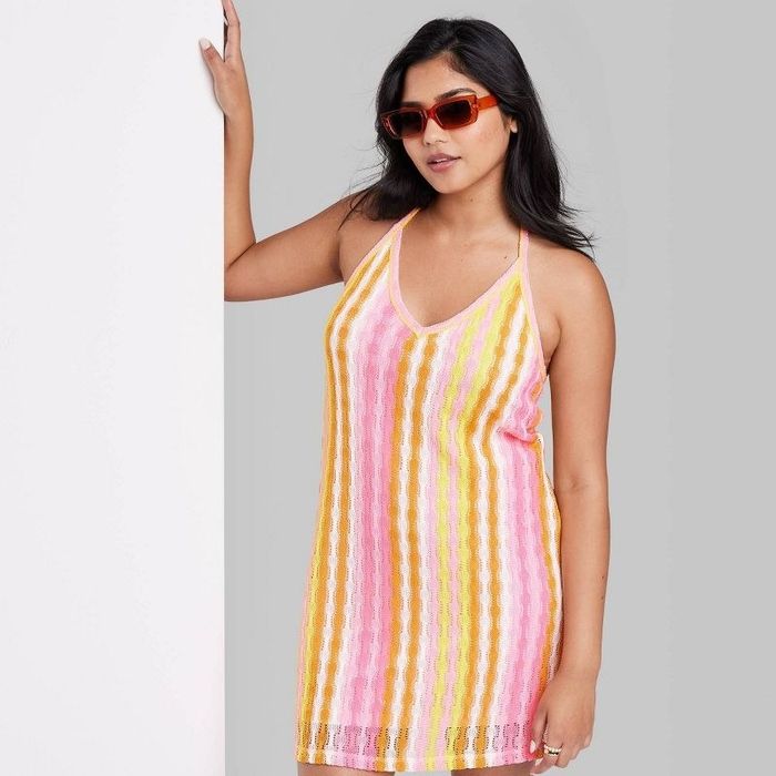 A model sporting the dress and sunglasses