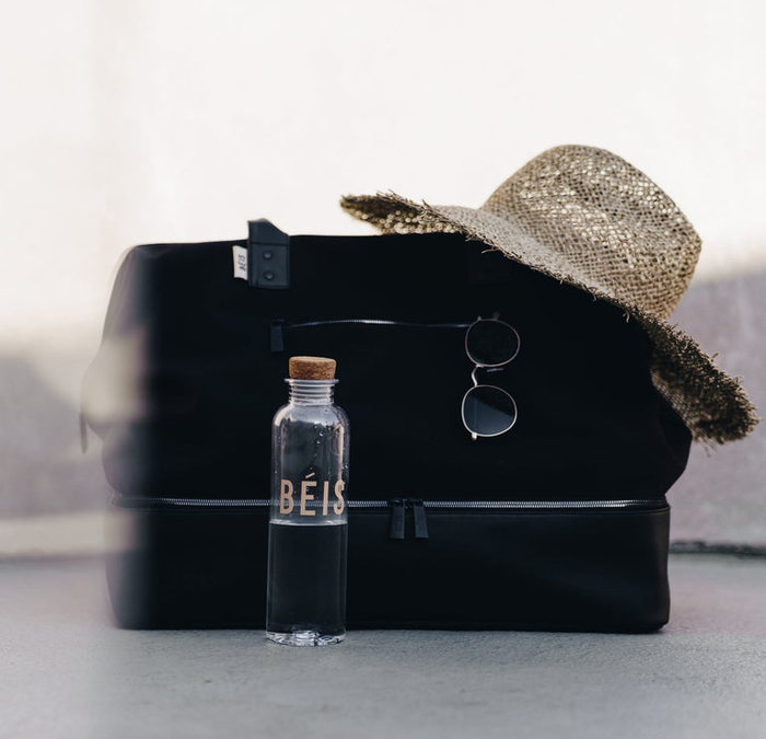 The duffle bag comes in a sleek black color.