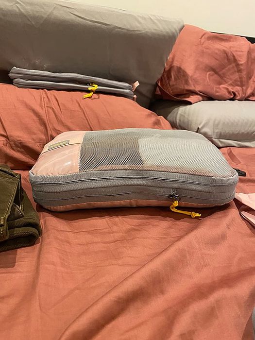 Another reviewer demonstrates how small the packing cube becomes once it’s been compressed, illustrating just how effective it is.