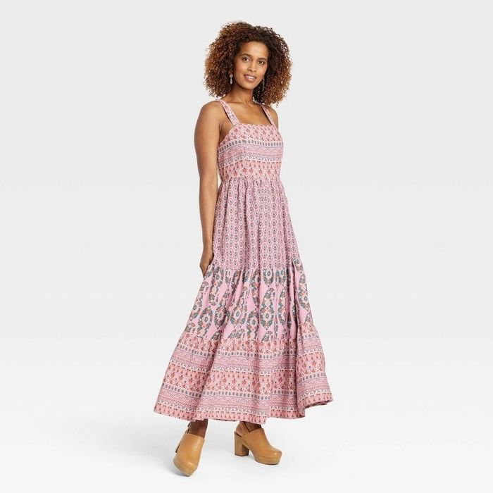 A model wearing a pink floral dress