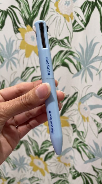 Jasmin is seen holding the multi-purpose pen.