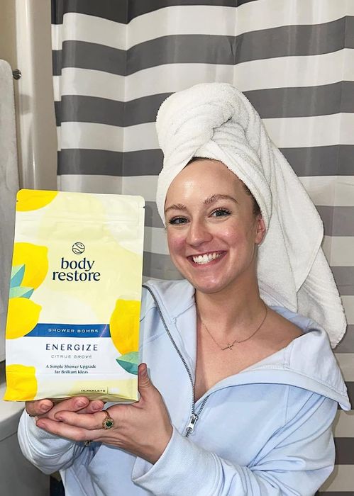 Reviewer holding a bag of bath fizzies