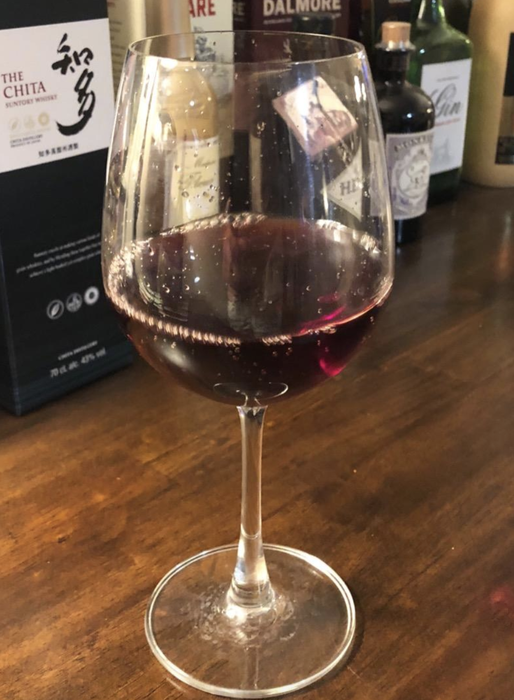 Reviewer’s photo of a glass of wine.