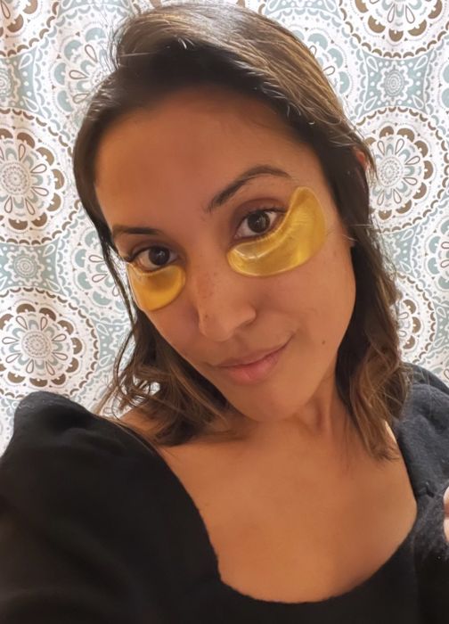 Mytour writer wearing gold eye masks.