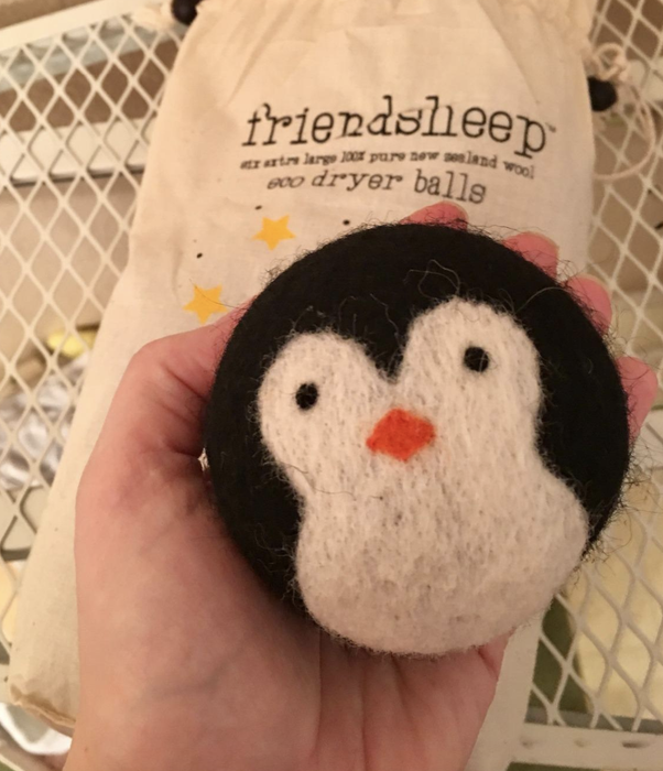 reviewer holding dryer ball