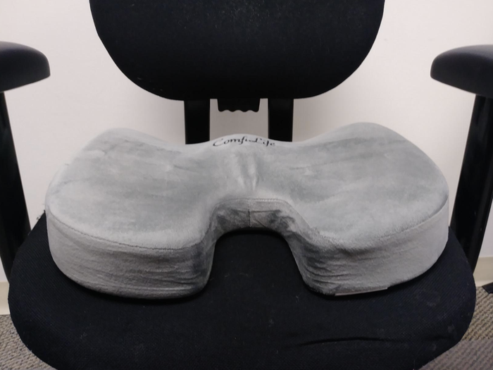 The U-shaped cushion on a chair.