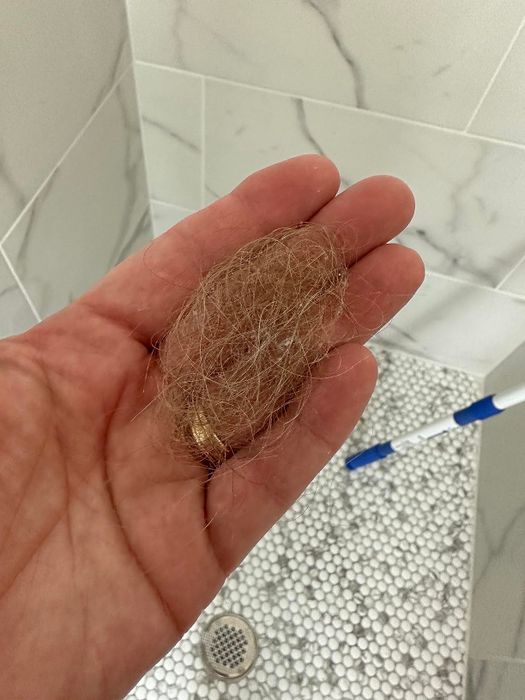 A clump of hair trapped in the drain.