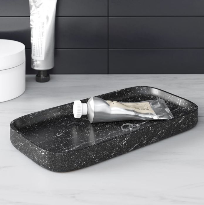 A sleek black vanity tray