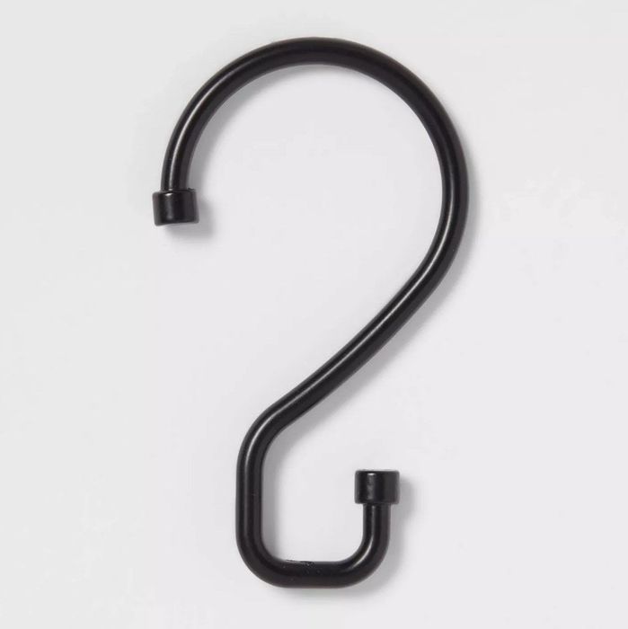 A matte black shower curtain hook.