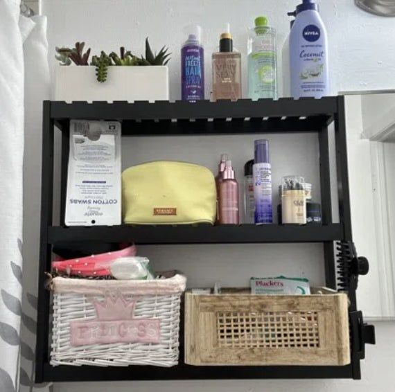 A reviewer's black bathroom shelves