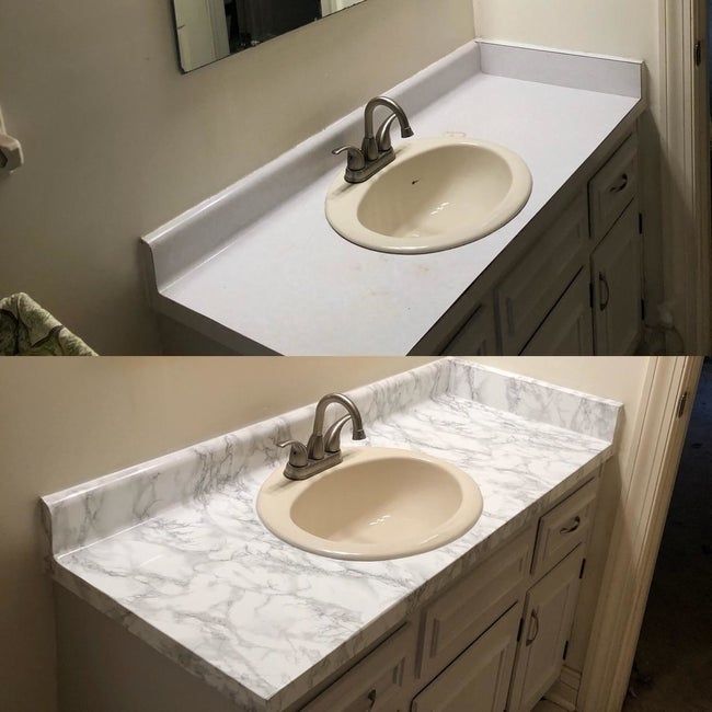 A reviewer's bathroom counter, with a plain surface on top and the same counter covered in marble adhesive film on the bottom