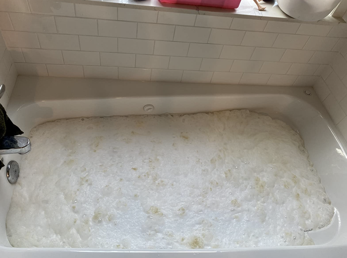 The tub is now completely filled with water and cleaner.