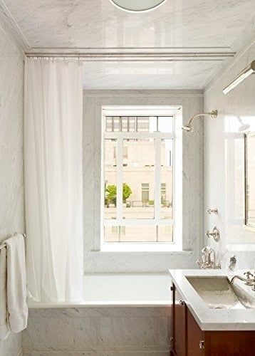 A shower with the curtain liner in place.