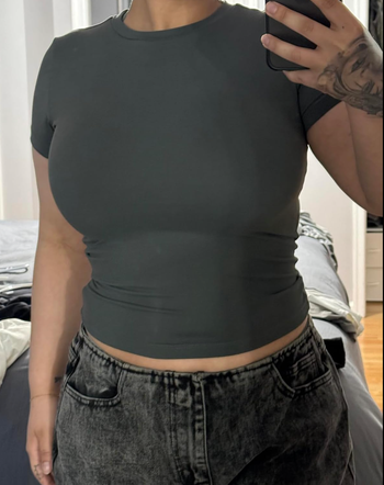 A person wearing the top in black