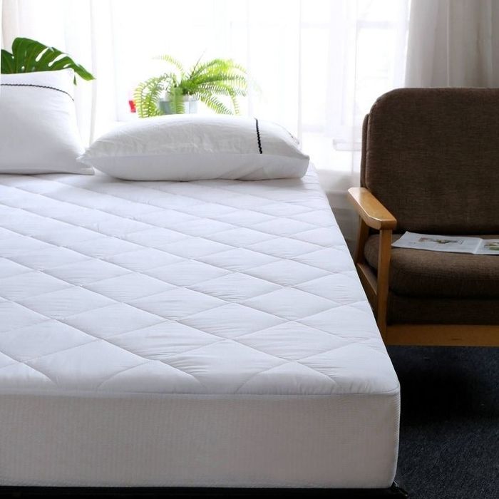 The mattress protector placed on a bed