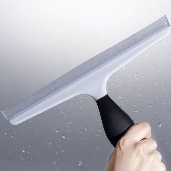 A model is holding the squeegee.