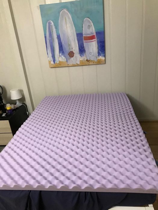 A photo uploaded by the reviewer showing the mattress topper