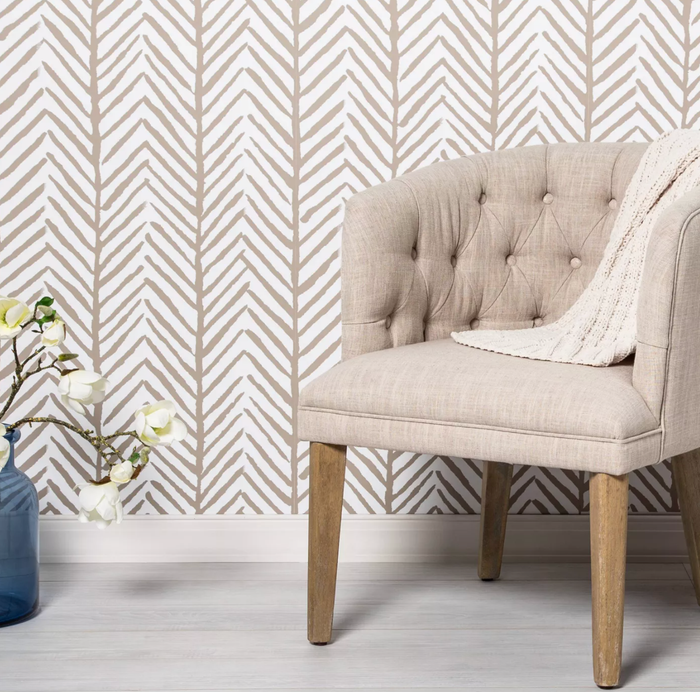 Tan herringbone stripe peel-and-stick wallpaper.