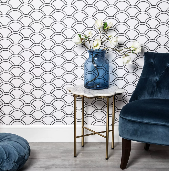 Black and white scalloped pattern peel-and-stick wallpaper.