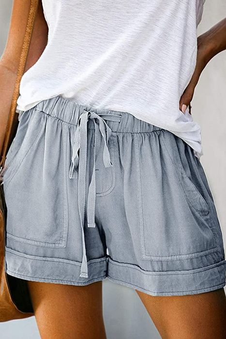 A model in pale blue drawstring shorts with pockets