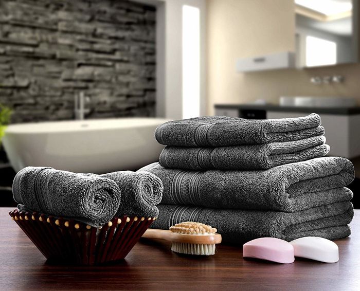 A set of dark gray towels that are both stylish and functional for your bathroom.