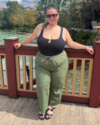 A reviewer striking a pose in the green version