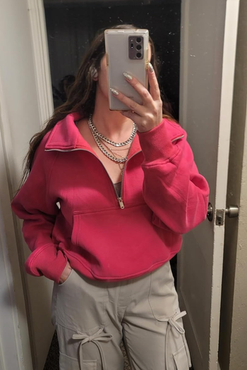A reviewer rocking the red version
