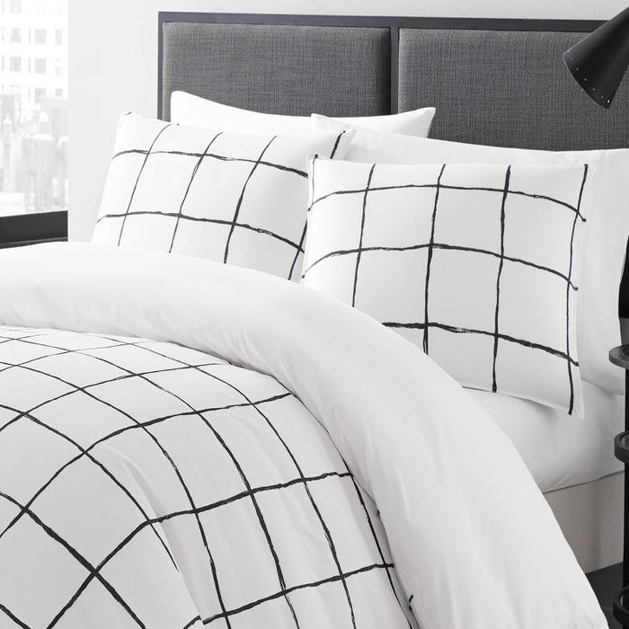 the black and white duvet set displayed on the bed