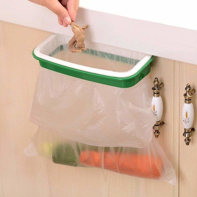 A holder with a plastic bag attached, conveniently hung on the door beneath the sink for easy access.