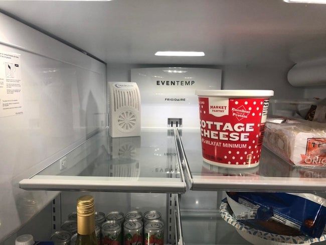 The deodorizer sitting neatly on a kitchen fridge shelf.