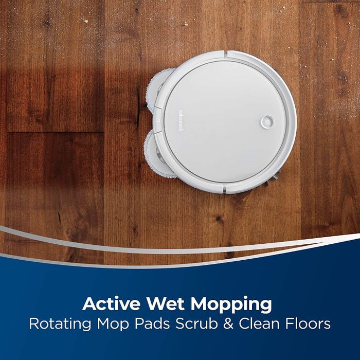 The product's rotating mop pads effortlessly cleaning a wood floor