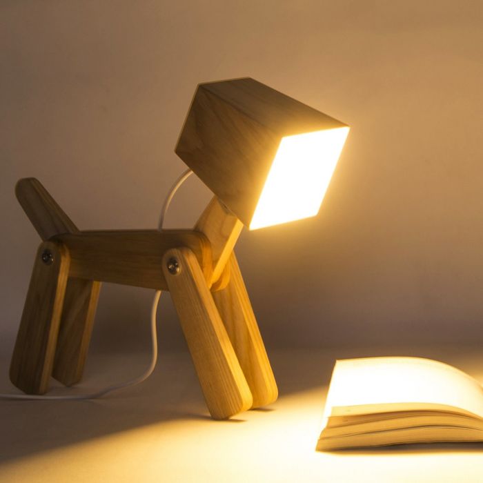 A wooden lamp featuring legs, a tail, and a square head—blending whimsy and functionality.