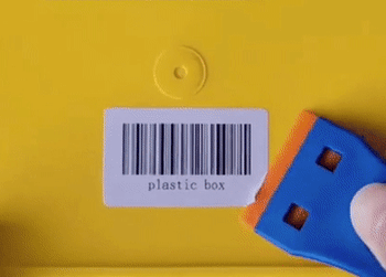 Gif showing someone using the scraper to peel off a sticker