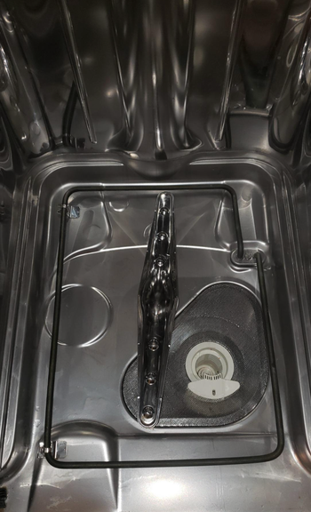 Same reviewer's photo showing the dishwasher interior sparkling clean
