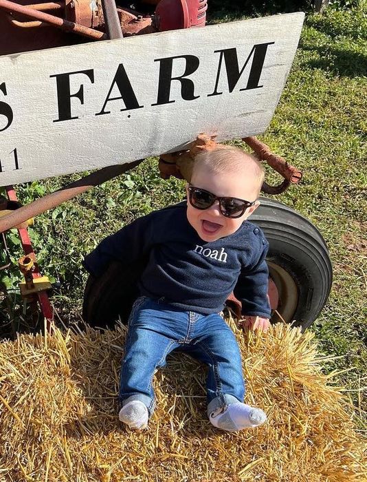 A baby sporting a pair of WeeFarer sunglasses