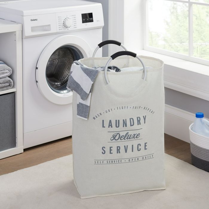 A laundry hamper featuring sturdy handles and labeled 
