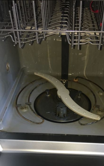 The same dishwasher, now completely free of stains after using the cleaning tablets