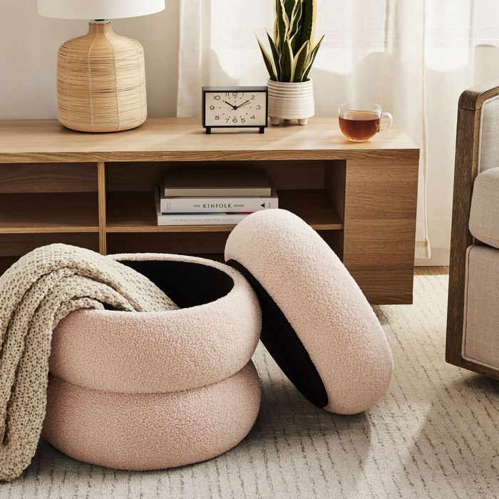 A boucle cloud storage ottoman that seamlessly combines style with storage in one piece.