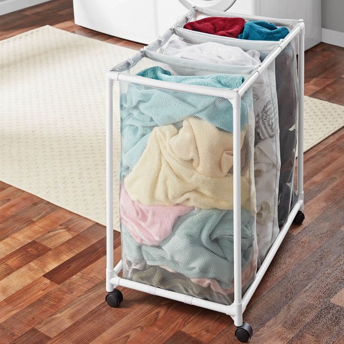 A laundry cart with separate sections for towels and clothes, making it a practical solution for organizing laundry in a laundry room.
