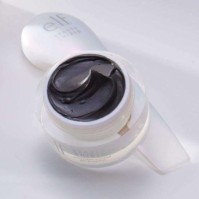 A jar containing a black mask