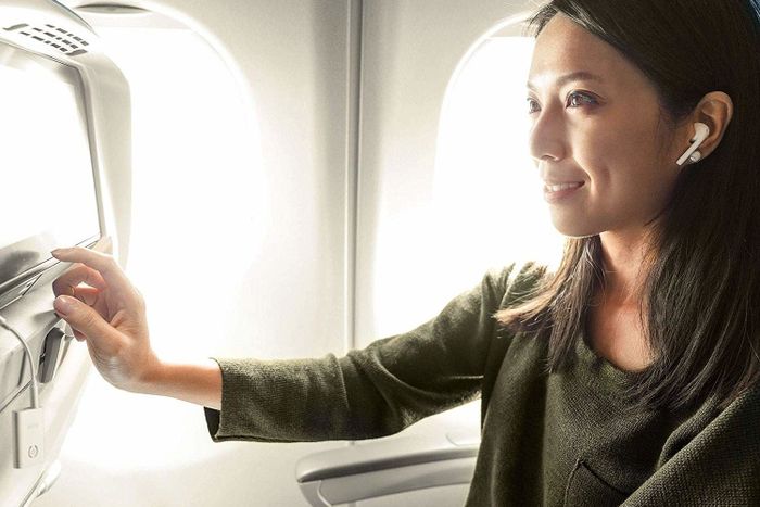 A person using the product on an airplane.
