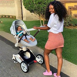 Another person walking with their baby in a stroller.