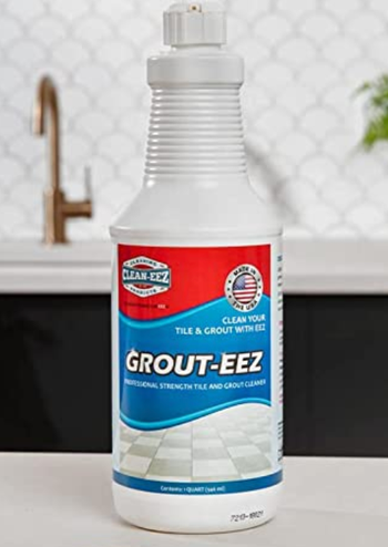 A bottle of Grout-eez sitting on a countertop, ready for action