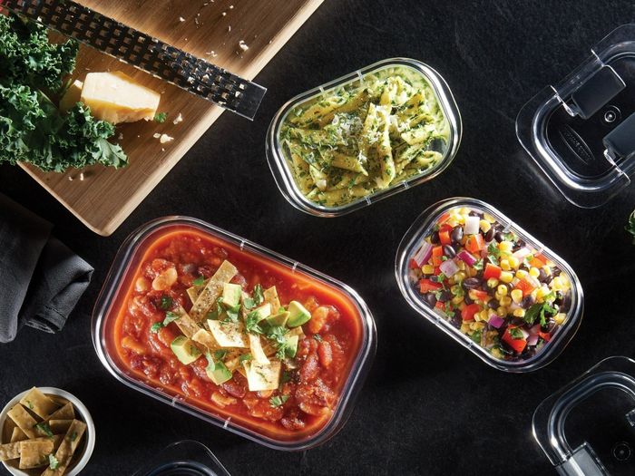 A 10-piece food storage set, displayed with chopped vegetables, a grater, and a cutting board, perfect for meal prep, leftovers, and portable lunch options.