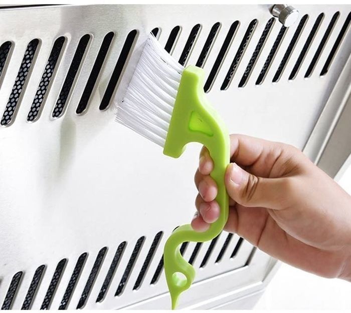 A model using an angled brush to clean vents, reaching all those tricky spots
