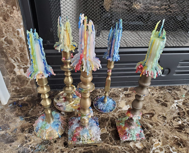 Reviewers showcase drip candles in vintage candelabras.