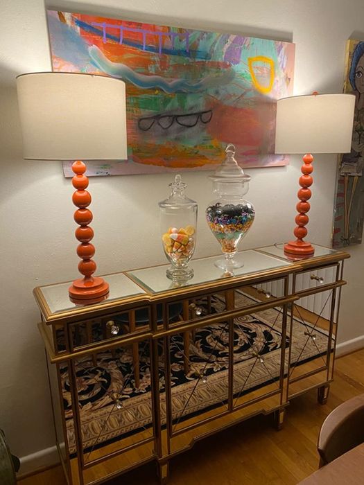 The reviewer's lamps placed on a mirrored console table
