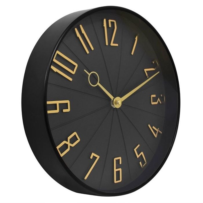 A wall clock with gold numbers and hands, offering a sophisticated and stylish look.