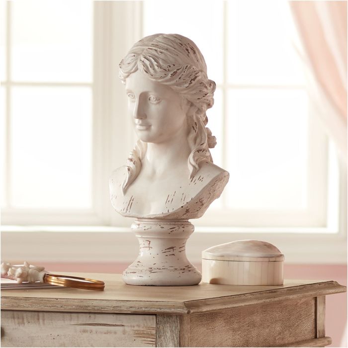 A 17 1/2-inch tall white Grecian bust sculpture, measuring 9 1/2 inches in width and 8 1/2 inches in depth.