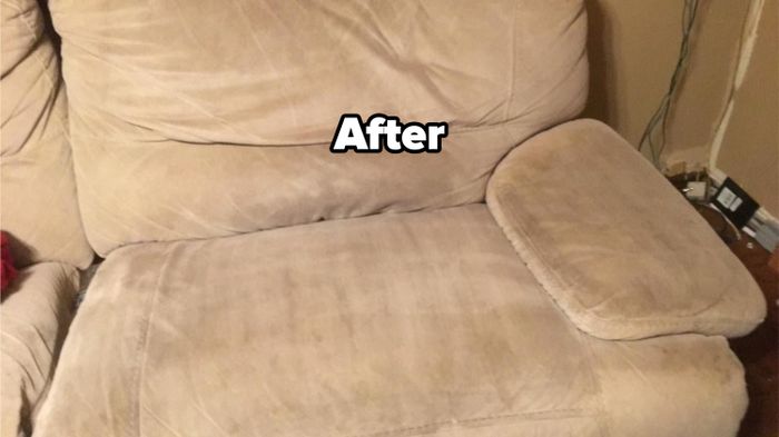 A reviewer’s photo showing the same couch with the stain completely removed.